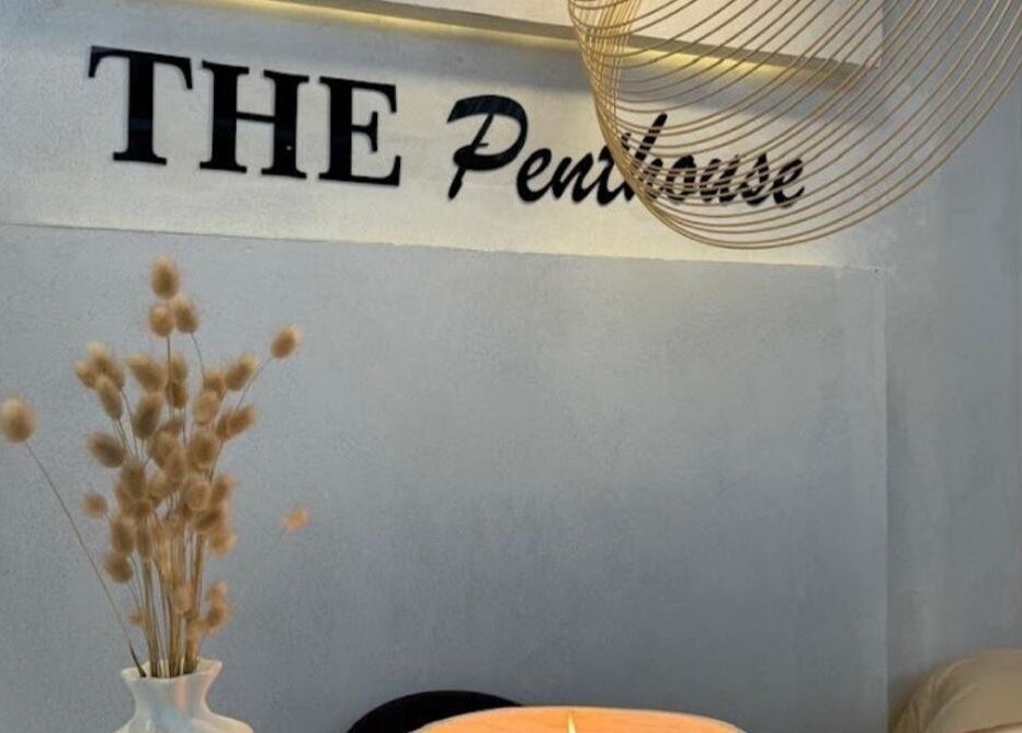 Cozy interior of The Penthouse Beauty Studio in Sandton, Gauteng, ZA featuring decor and soft lighting.