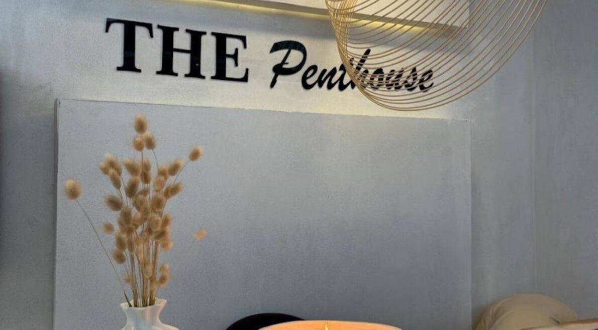 Cozy interior of The Penthouse Beauty Studio in Sandton, Gauteng, ZA featuring decor and soft lighting.