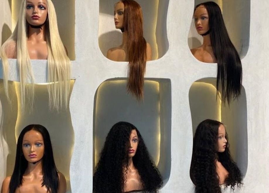 Mannequin heads with varied wigs at The Penthouse Beauty Studio, Sandton, Gauteng, ZA.