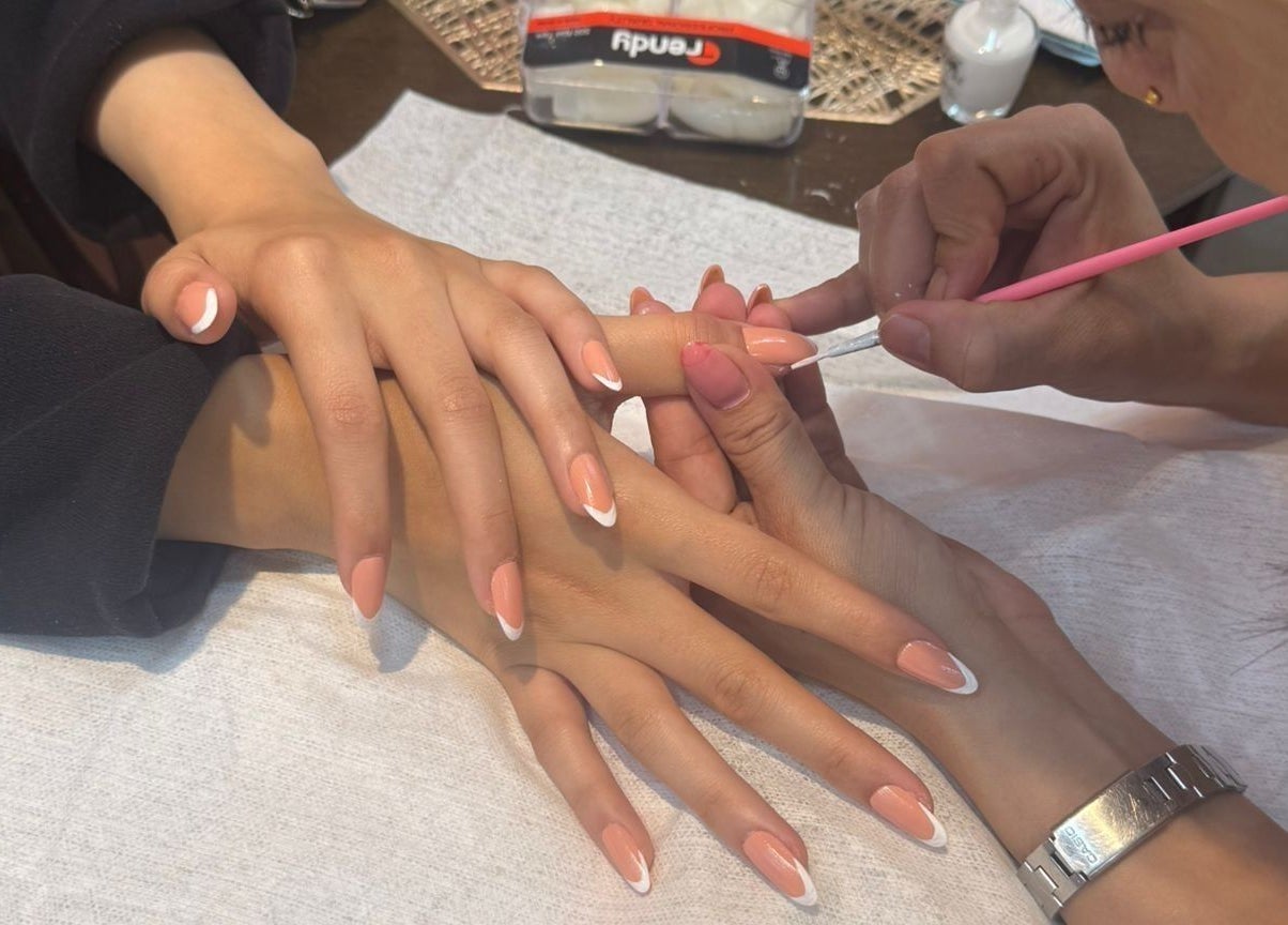 Nail artist at Remal Beauty Salon, Zinj, Muḥāfaẓat Al-ʿāṣimah, BH creates a perfect manicure.