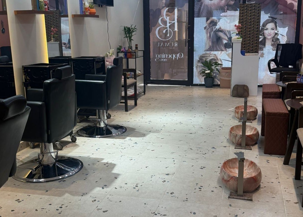 Modern interior of Remal Beauty Salon in Zinj, Muḥāfaẓat Al-ʿāṣimah, BH with sleek chairs and decor.