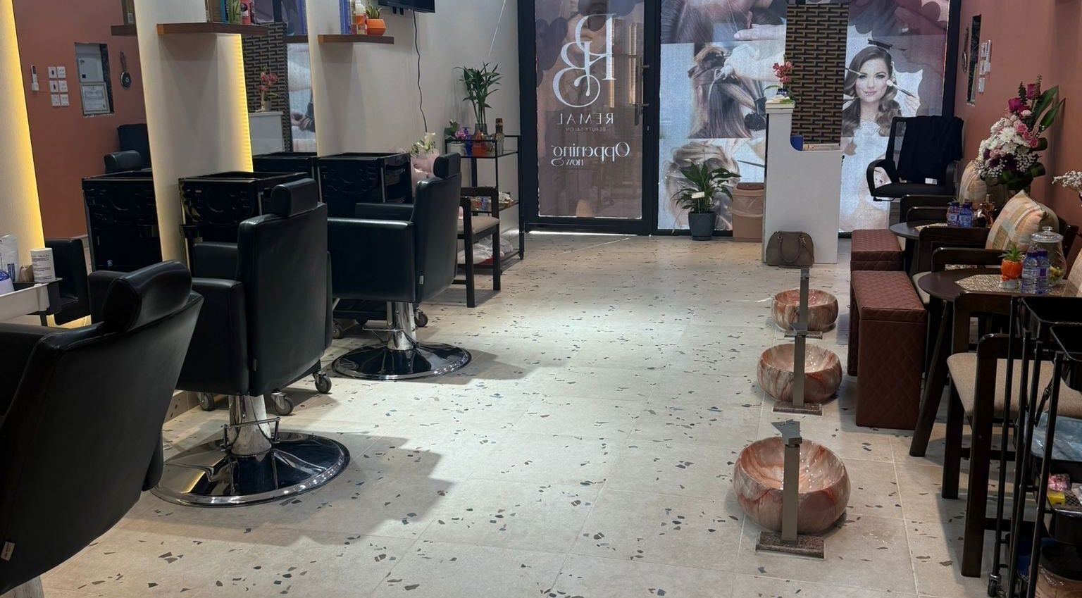 Modern chic interior of Remal Beauty Salon, Zinj, Muḥāfaẓat Al-ʿāṣimah, BH with stylish seating and decor.