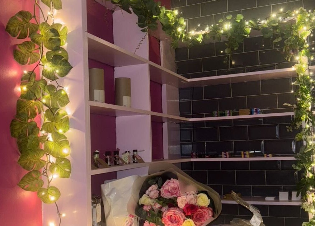 Charming interior of Beautiful Natural Spiritual in East Kilbride, Scotland, GB adorned with flowers and greenery.