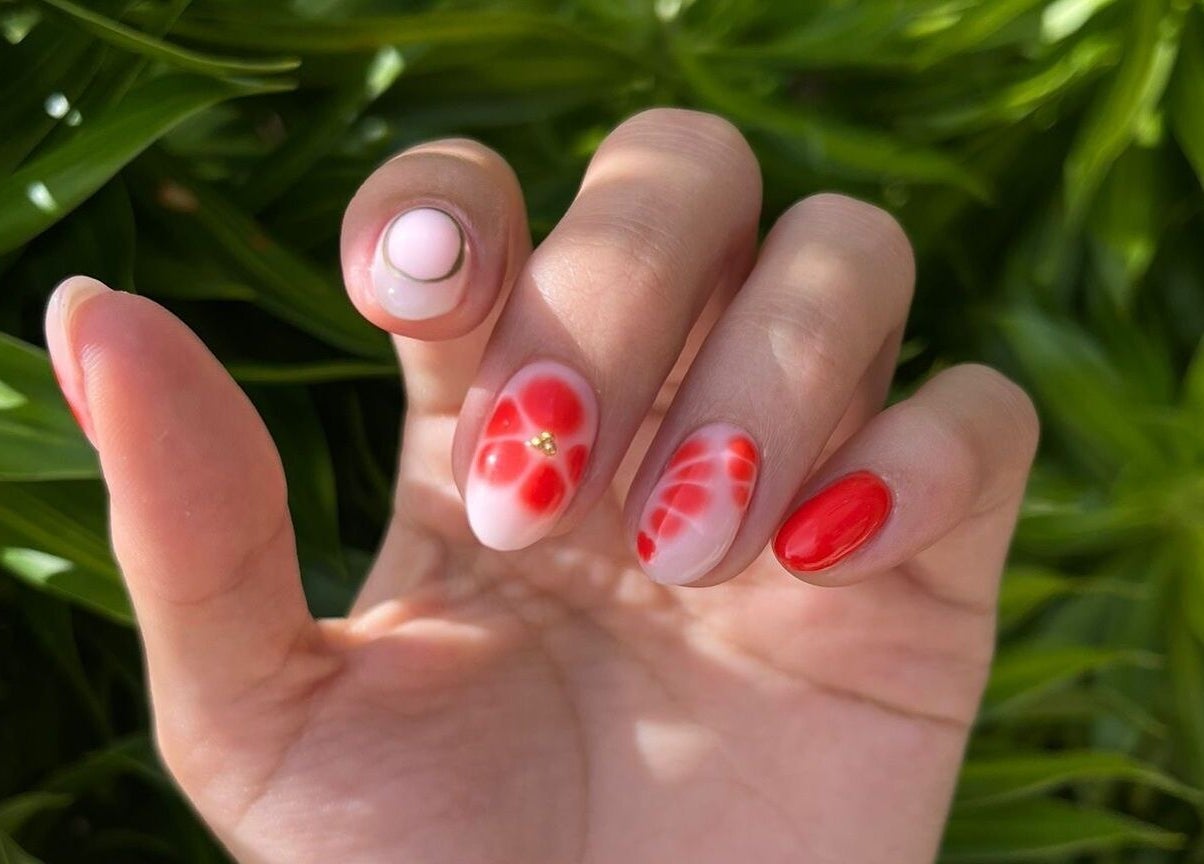 Elegant red and white floral nail art at Nailz, Guaynabo, PR, PR. Perfect blend of creativity and style.