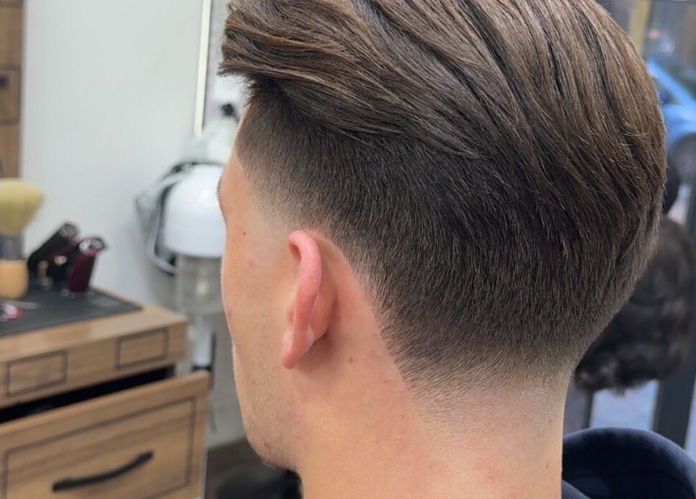 Sleek fade haircut at Rayan Barber, Liverpool, England, GB, showcasing expert styling.