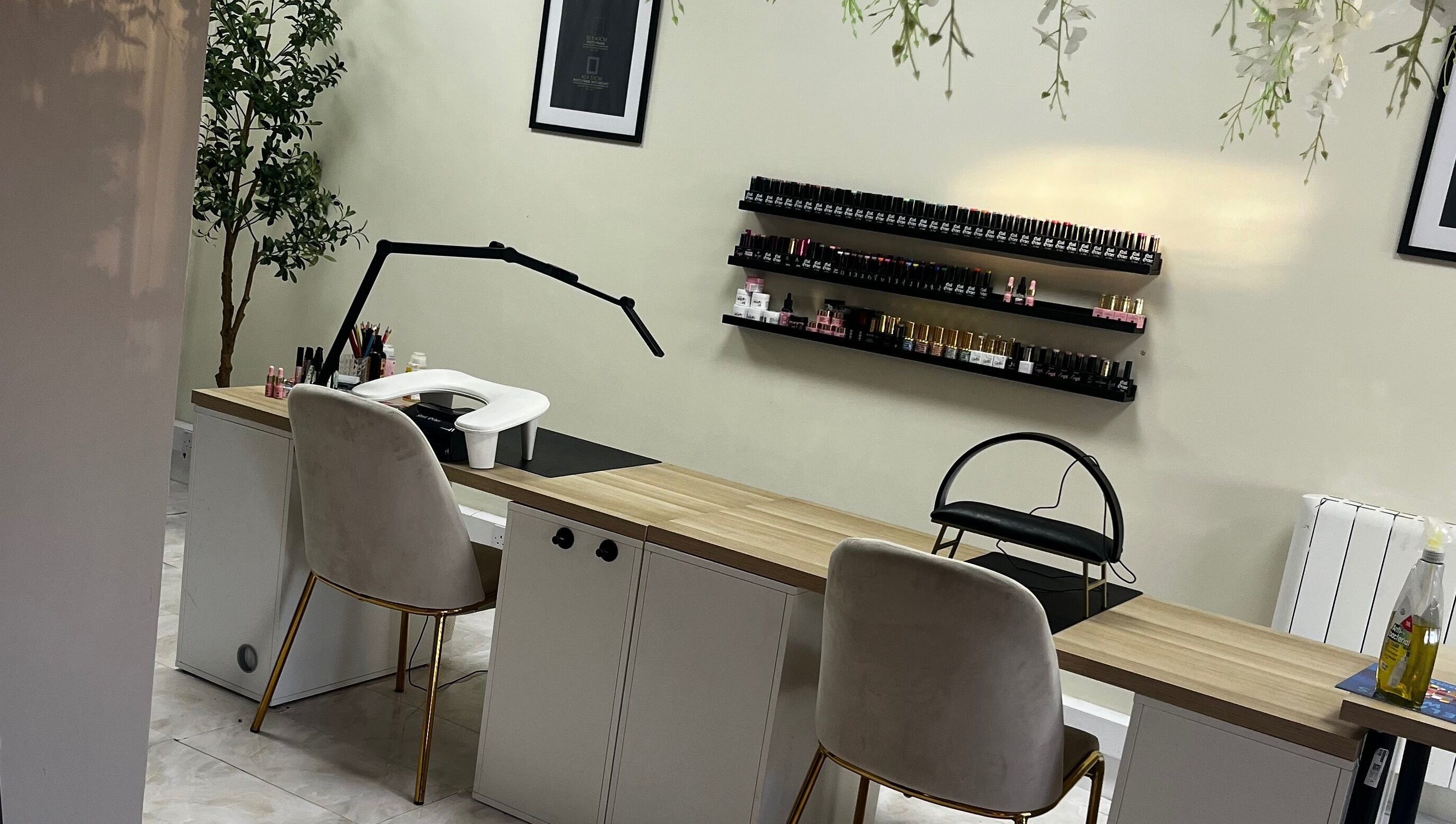 Elegant nail salon setup at By Carly, Wolverhampton, England, GB, showcasing a manicure station with nail polish display.