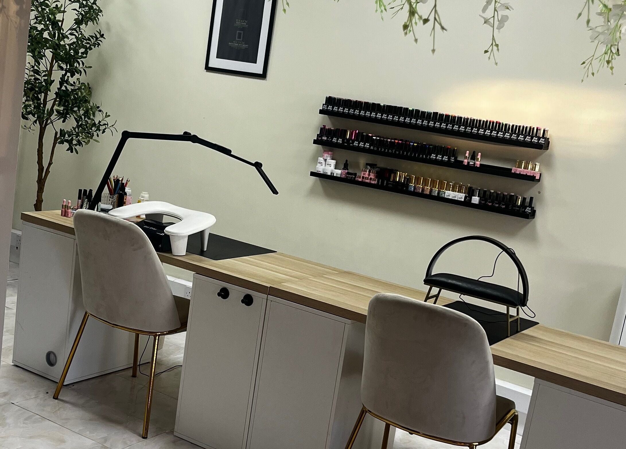 Elegant nail salon setup at By Carly, Wolverhampton, England, GB, showcasing a manicure station with nail polish display.