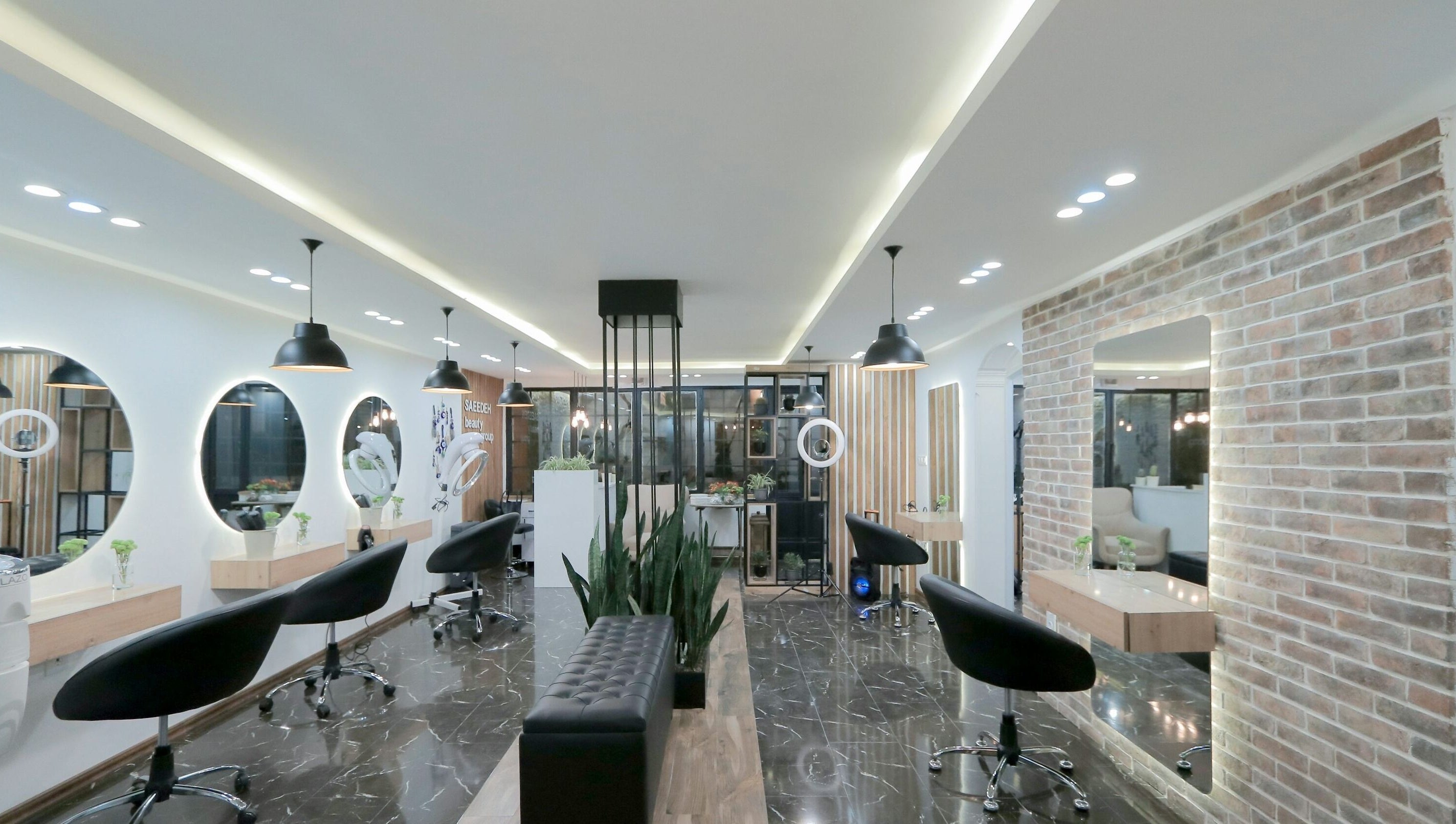 Modern interior of Bella's Beauty Bar in Vancouver, British Columbia, CA with stylish lighting and seating.