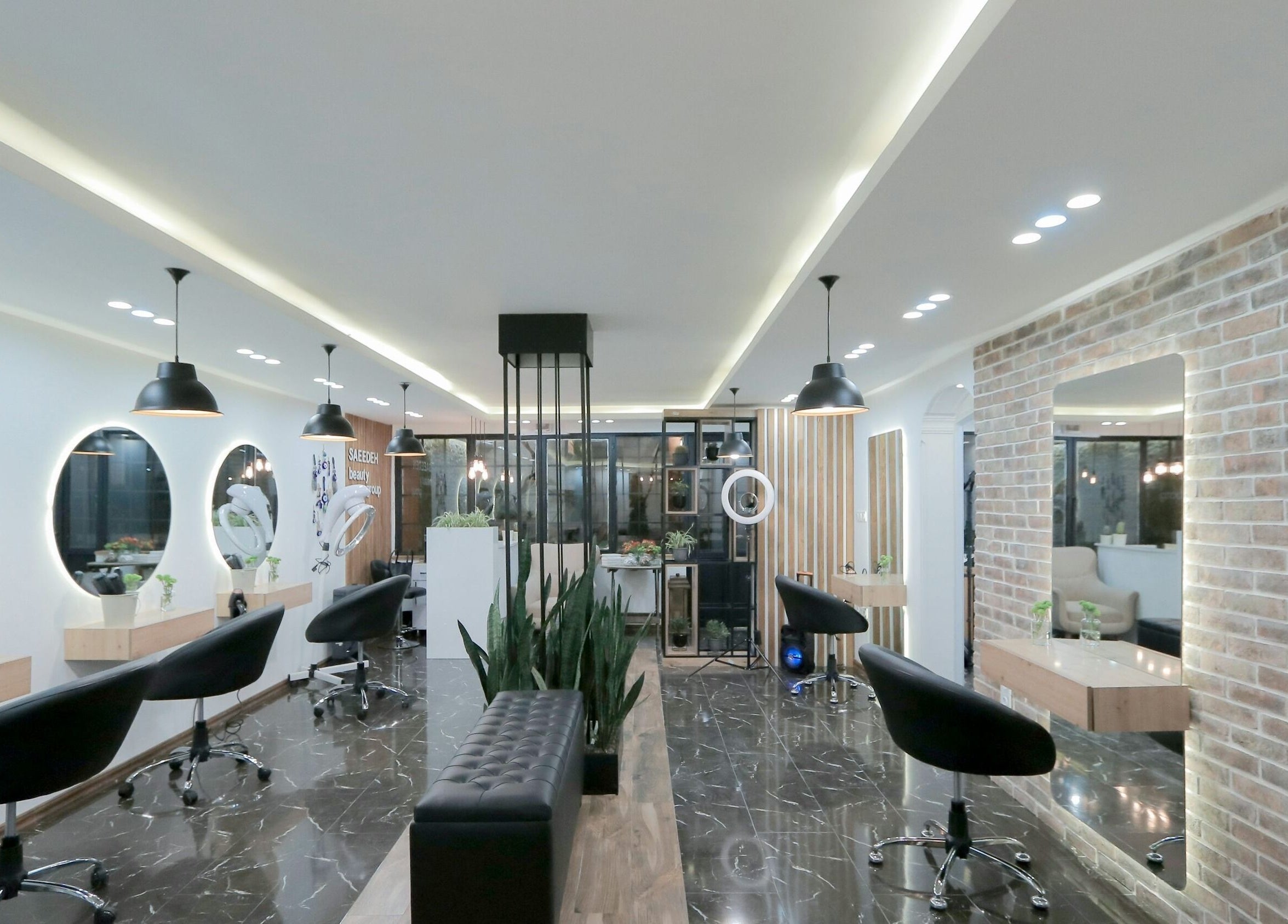 Modern interior of Bella's Beauty Bar in Vancouver, British Columbia, CA with stylish lighting and seating.