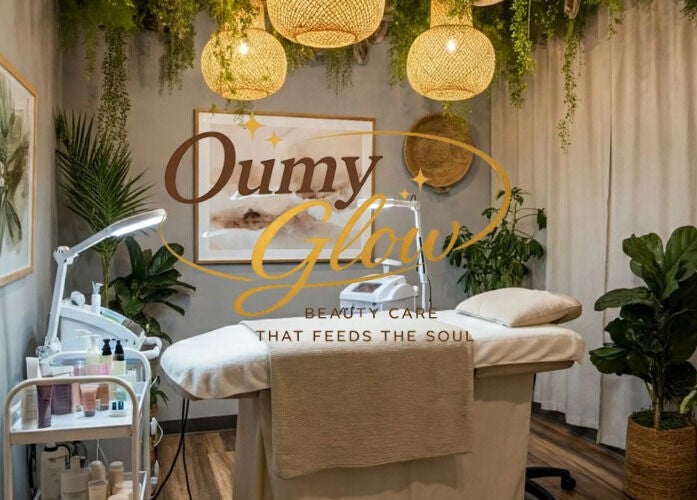 Relaxing treatment room at Oumy Glow in Pennsylvania, US featuring lush plants and warm lighting.