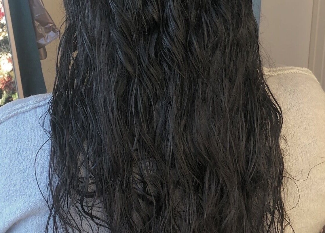 Wet, wavy hair showcased at VIP Beauty Studio in Sherwood Park, Alberta, CA.