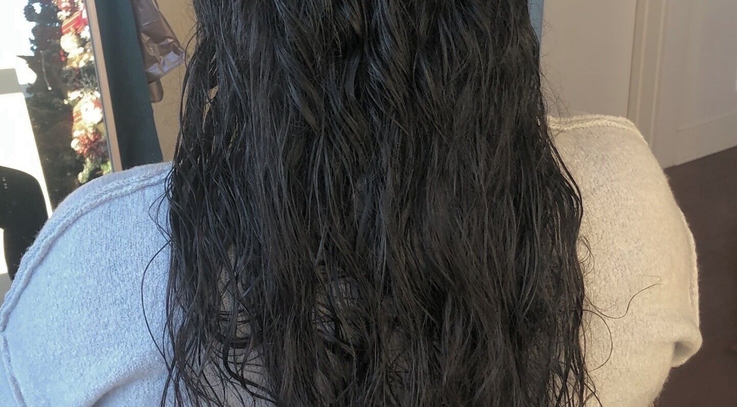 Wet, wavy hair showcased at VIP Beauty Studio in Sherwood Park, Alberta, CA.