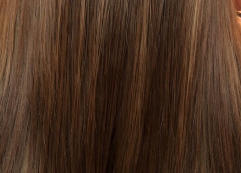 Sleek brown hair styled at VIP Beauty Studio, Sherwood Park, Alberta, CA.