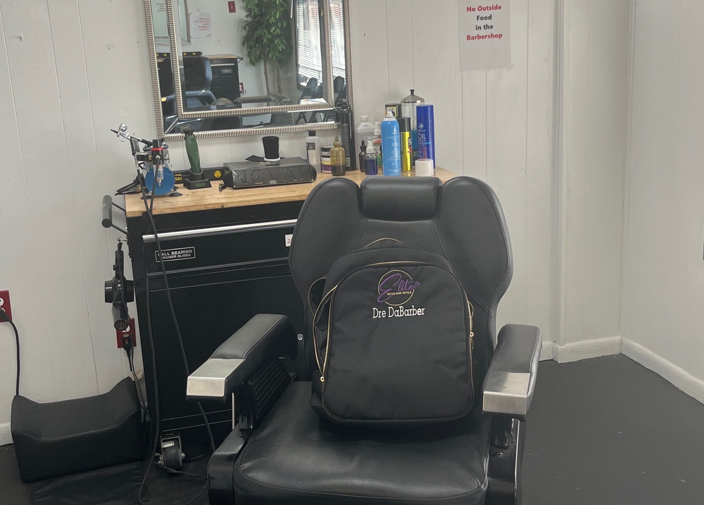 Barber chair and tools at Elite Kutz and Stylz LLC, Tupelo, Mississippi, US, showcasing a professional setup.