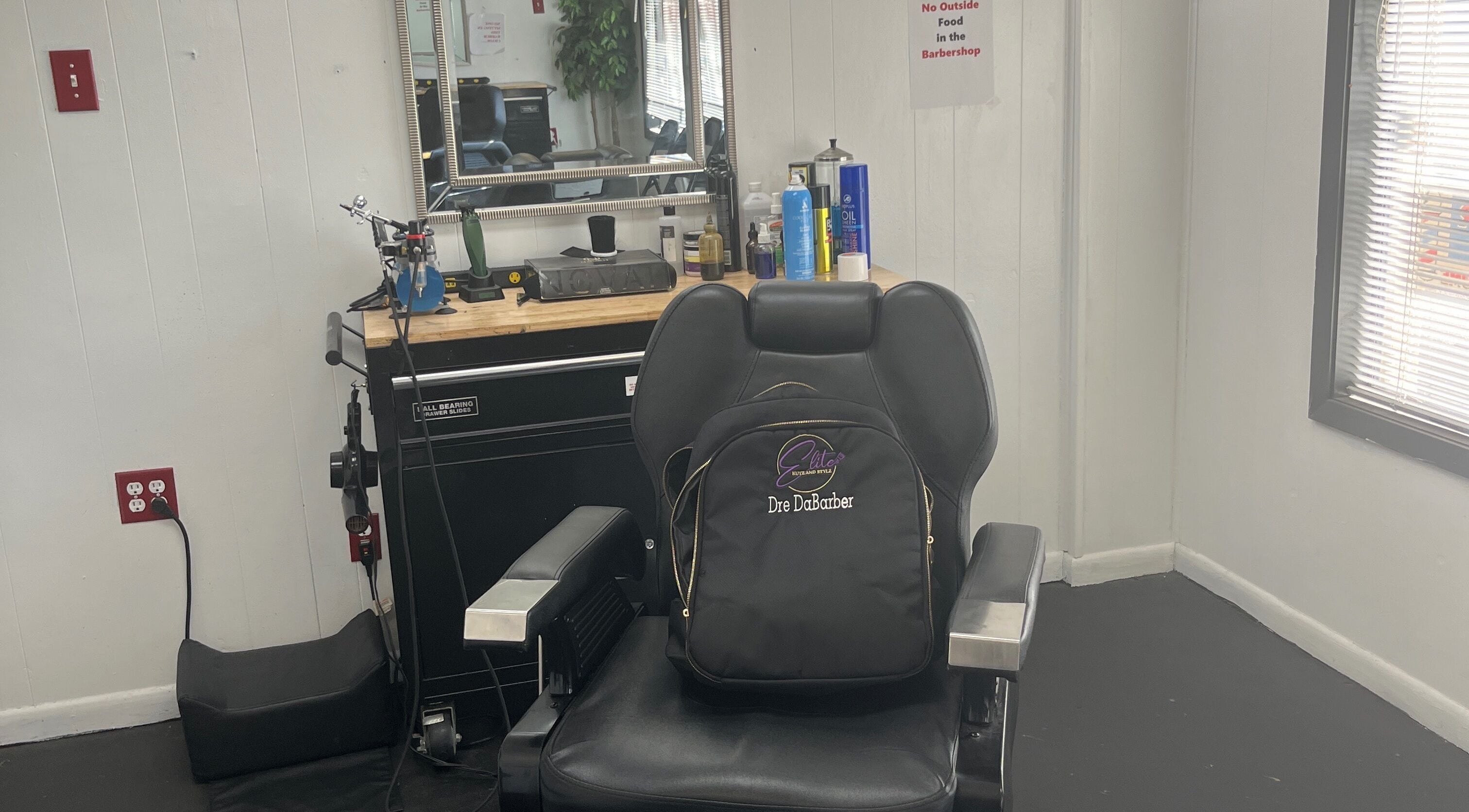 Barber chair and tools at Elite Kutz and Stylz LLC, Tupelo, Mississippi, US, showcasing a professional setup.