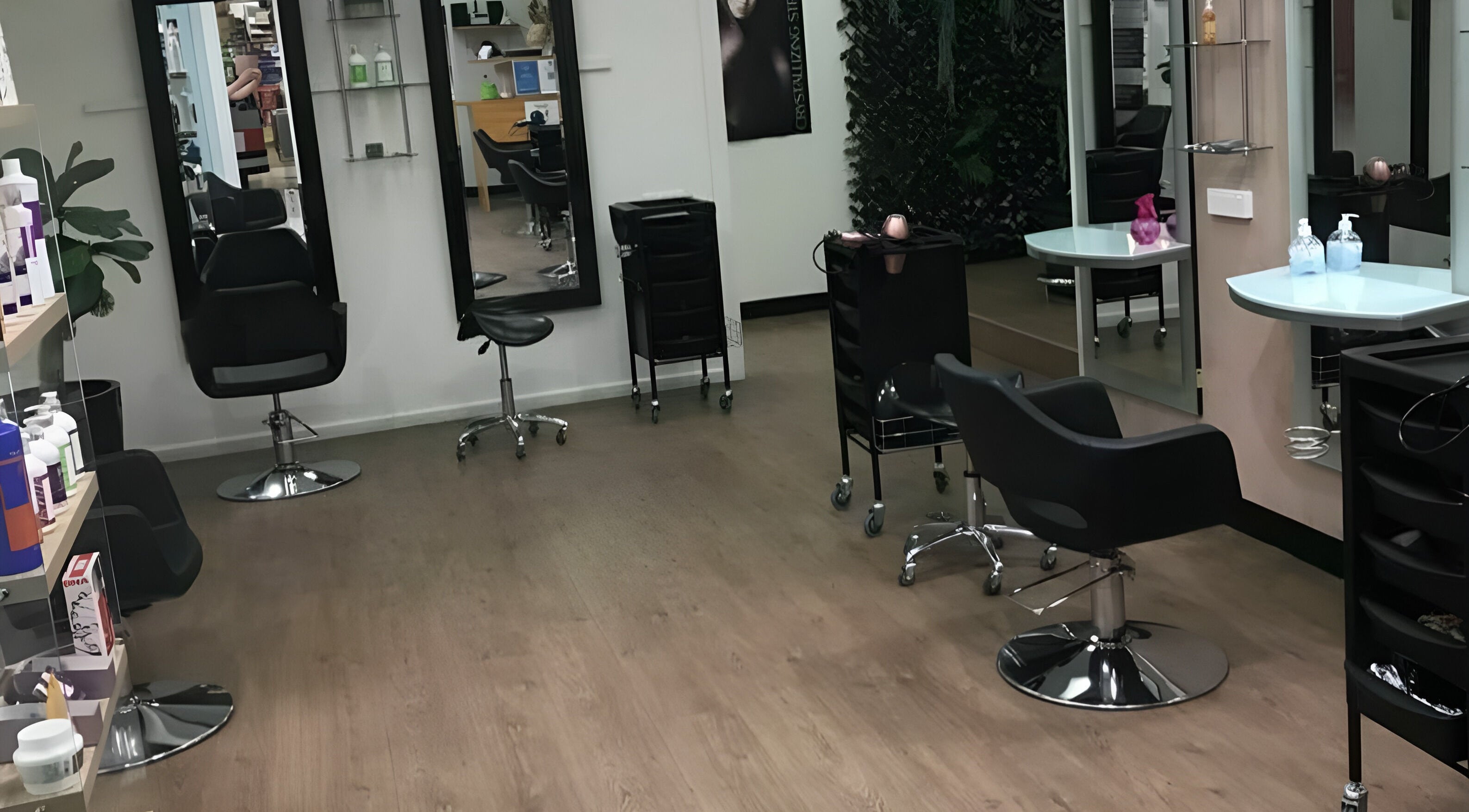 Modern styling chairs at Hair at St Martins, Blacktown, New South Wales, AU. Sleek design and professional setup.