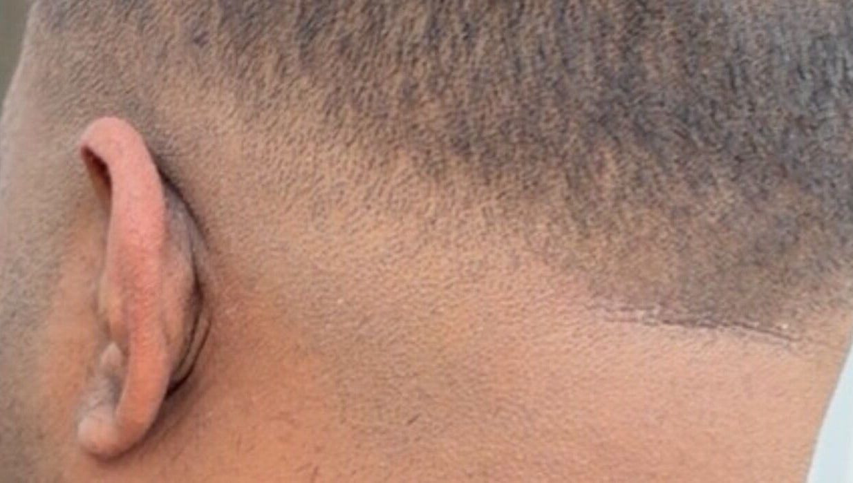 Close-up of a fresh fade hairstyle at Dxr Cutz, Enschede, Overijssel, NL, showcasing detail and precision.