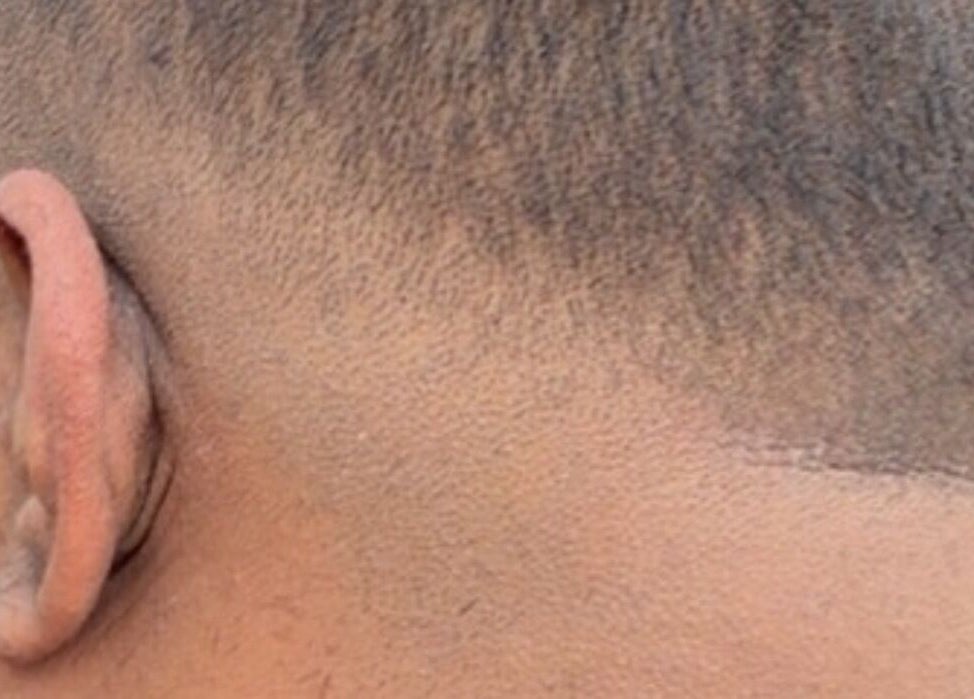 Close-up of a fresh fade hairstyle at Dxr Cutz, Enschede, Overijssel, NL, showcasing detail and precision.