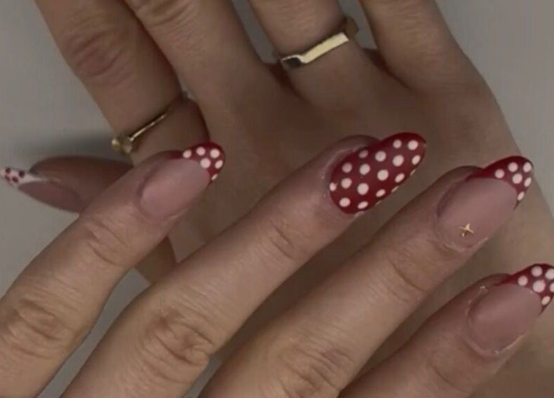 Chic polka dot nails at Nails by Ela, Blainville, Québec, CA showcasing elegant nail art.