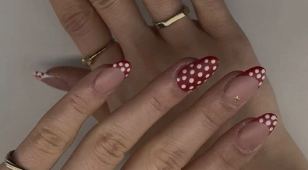 Chic polka dot nails at Nails by Ela, Blainville, Québec, CA showcasing elegant nail art.