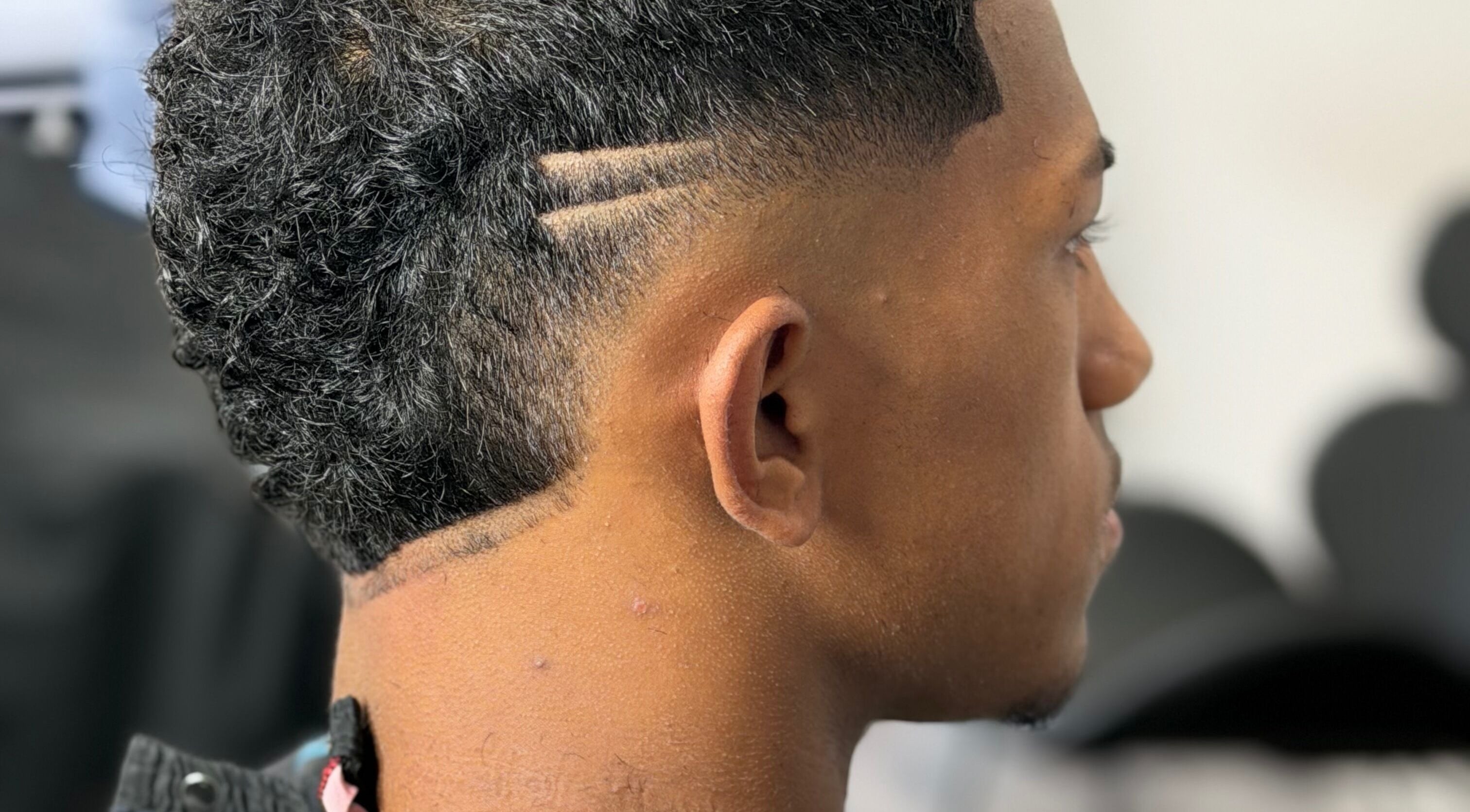 Close-up of modern haircut at JTRIMZ in Guildford West, New South Wales, AU, showcasing precise styling.