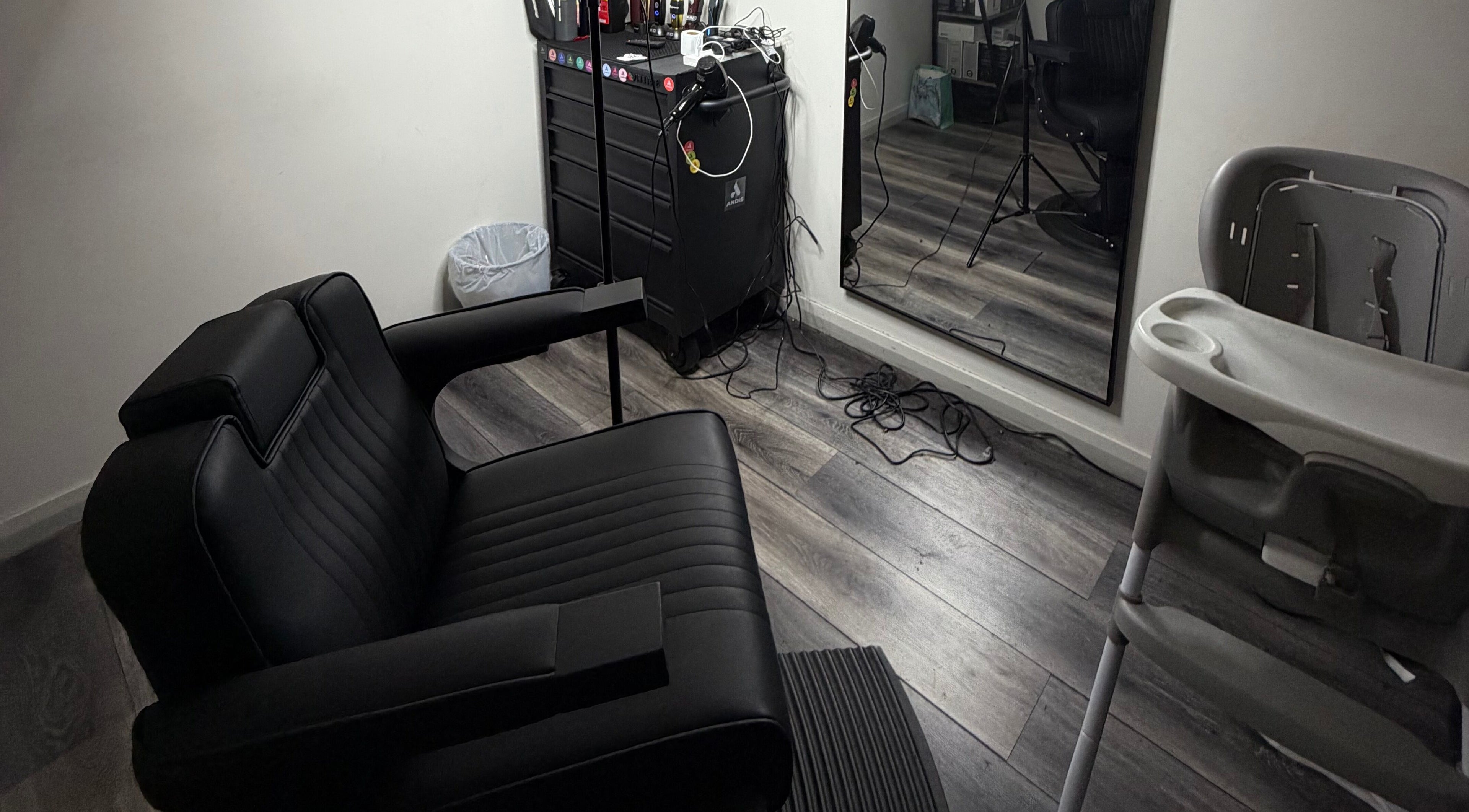 Modern salon chair and mirror at JTRIMZ in Guildford West, New South Wales, AU.