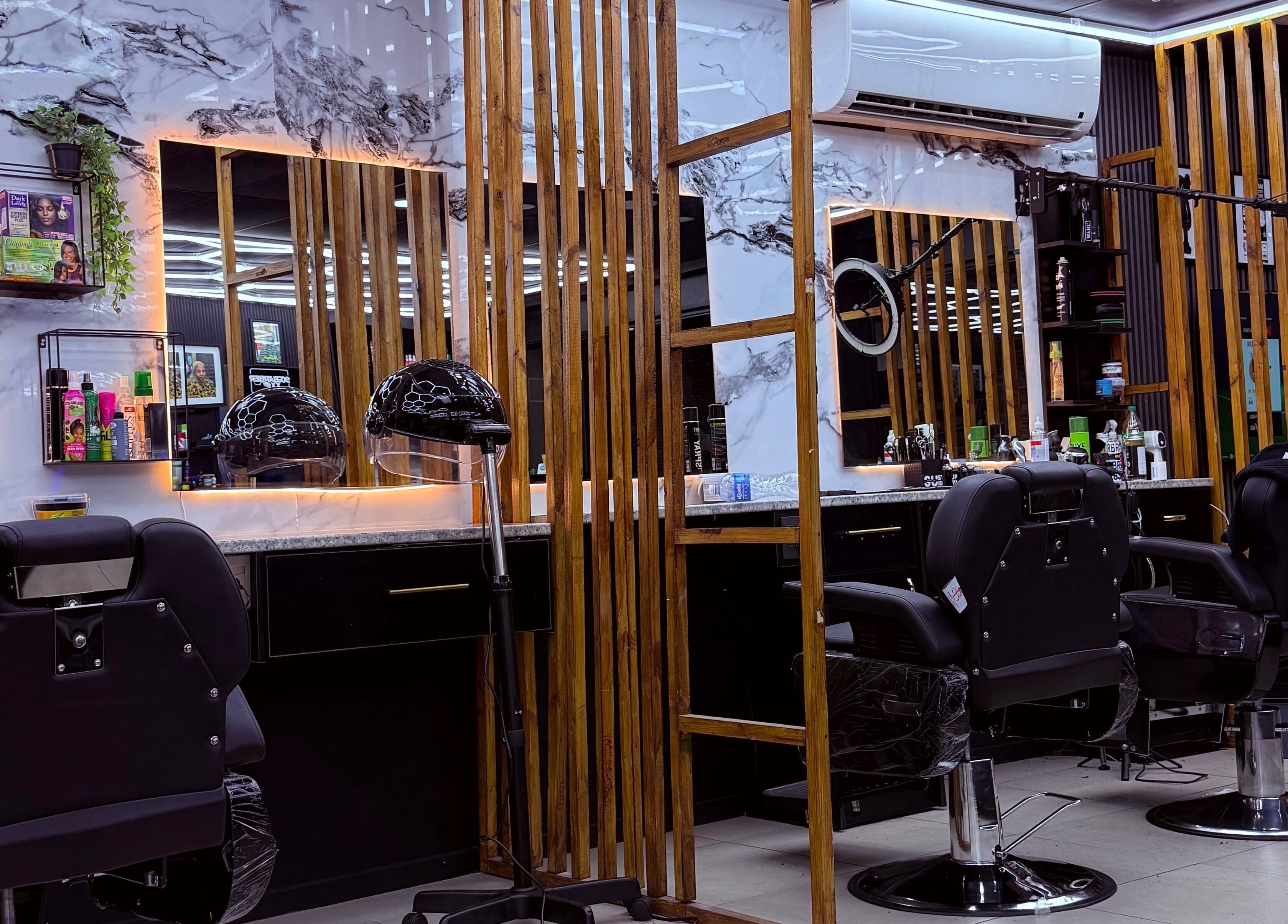 Sleek interior of 90s barberxx shop, Middelburg, Mpumalanga, ZA, with chairs and mirrors.