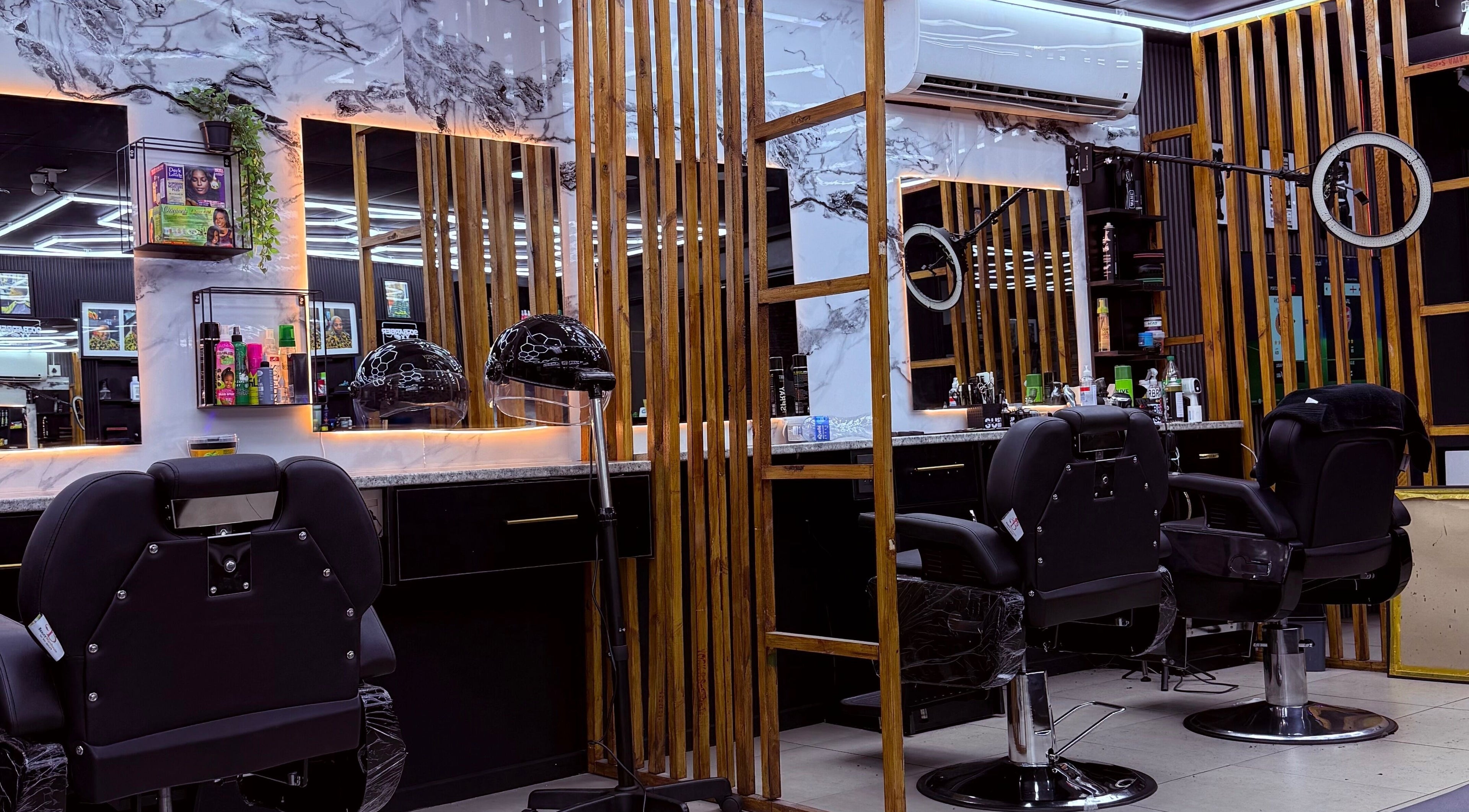 Sleek interior of 90s barberxx shop, Middelburg, Mpumalanga, ZA, with chairs and mirrors.