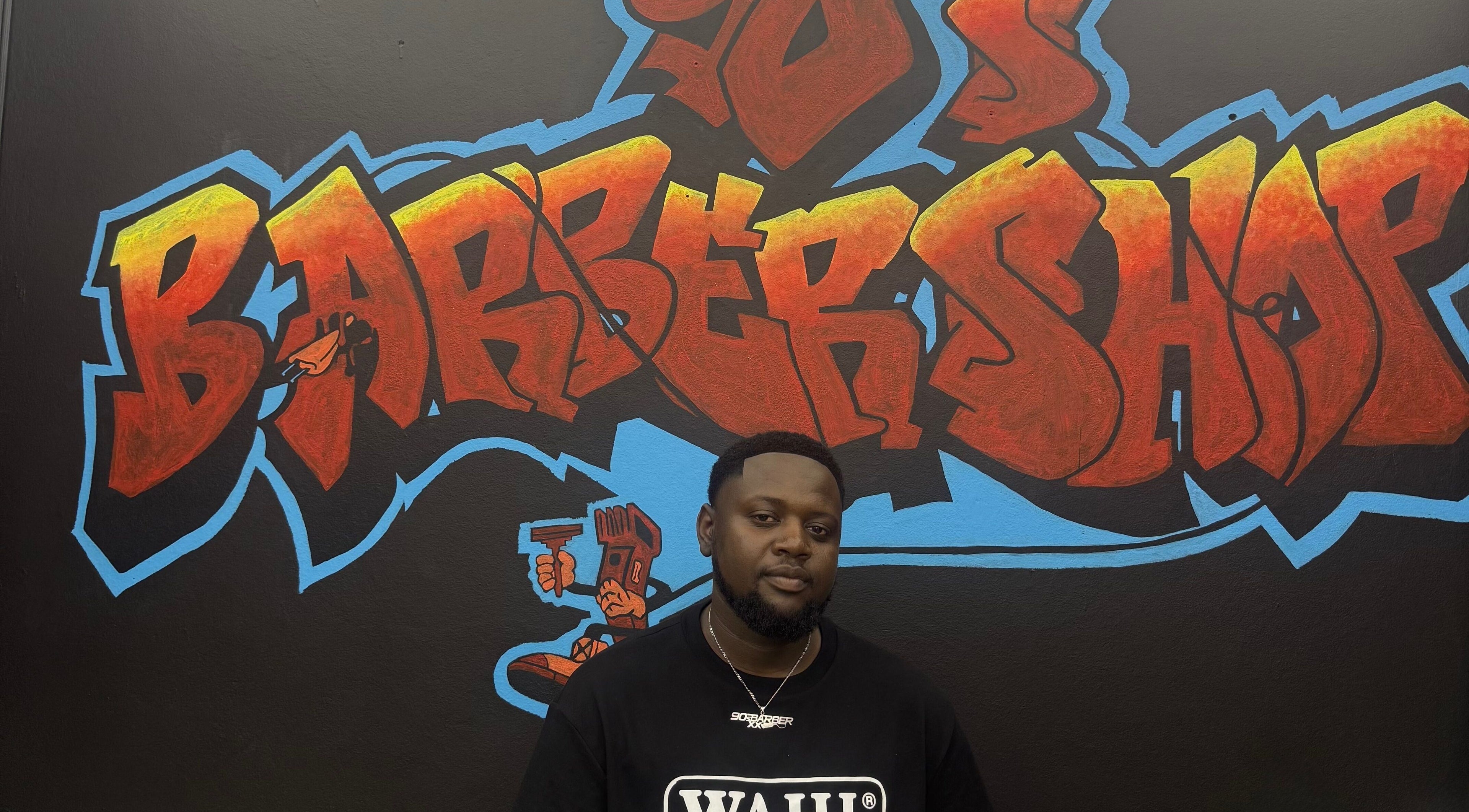 Colorful graffiti mural inside 90s barberxx shop, Middelburg, Mpumalanga, ZA.