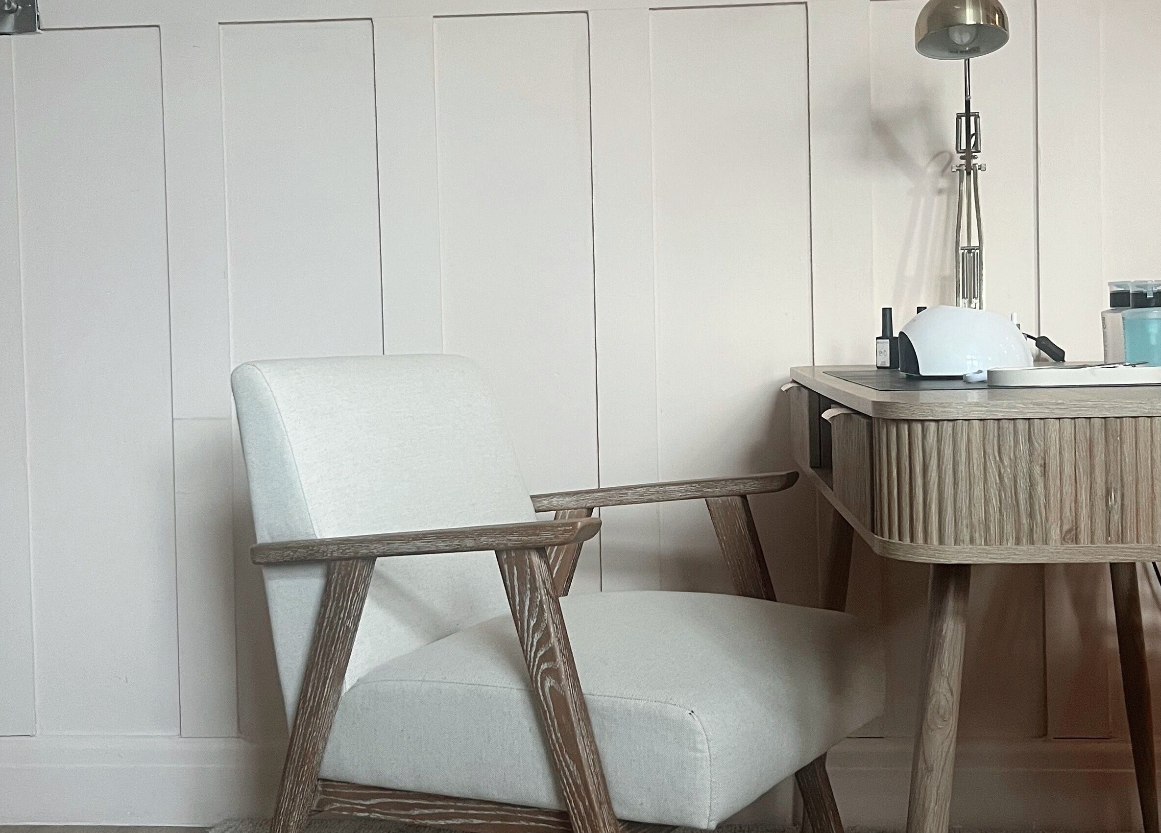 Cozy manicure station at Manicure by Elizabeth, Hyde, England, GB, featuring a sleek desk and comfortable chair.