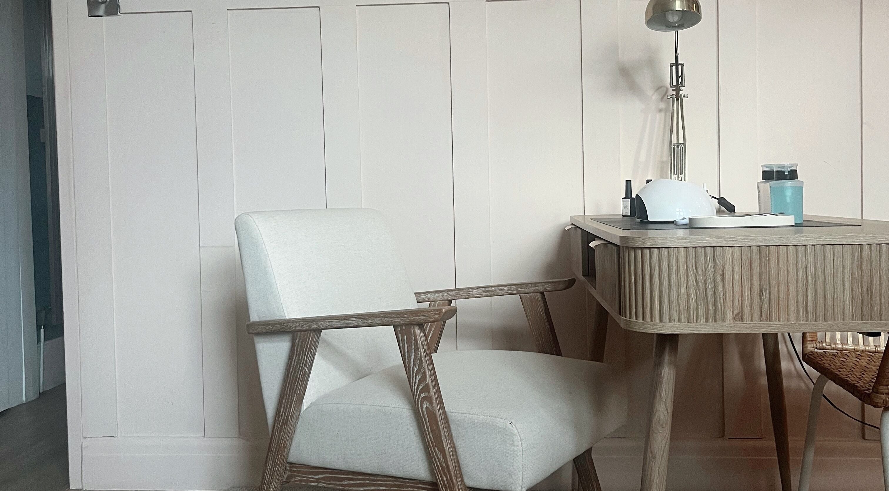 Cozy manicure station at Manicure by Elizabeth, Hyde, England, GB, featuring a sleek desk and comfortable chair.