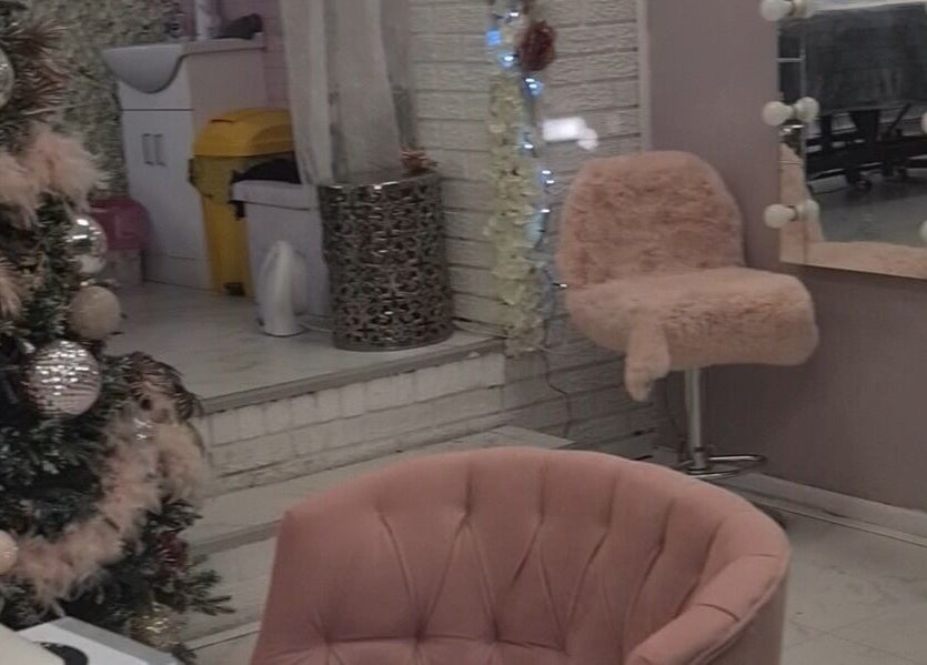 Warm, inviting interior of The Healing Touch, Sunderland, England, GB, with soft chairs and festive decor.