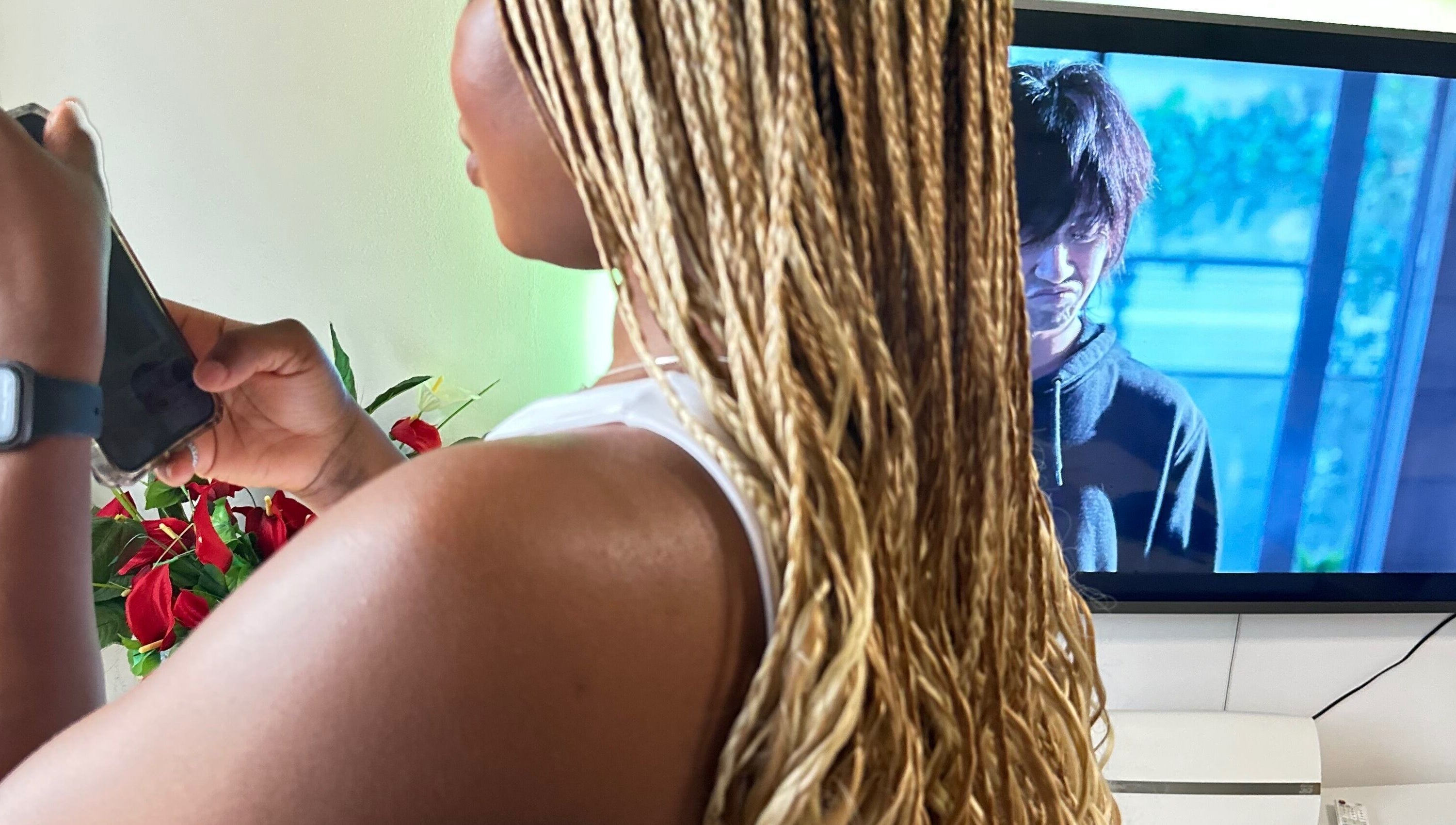 Stylish braids at Hair & Beauty By Sandyrule in Erith, England, GB. Vibrant salon atmosphere.