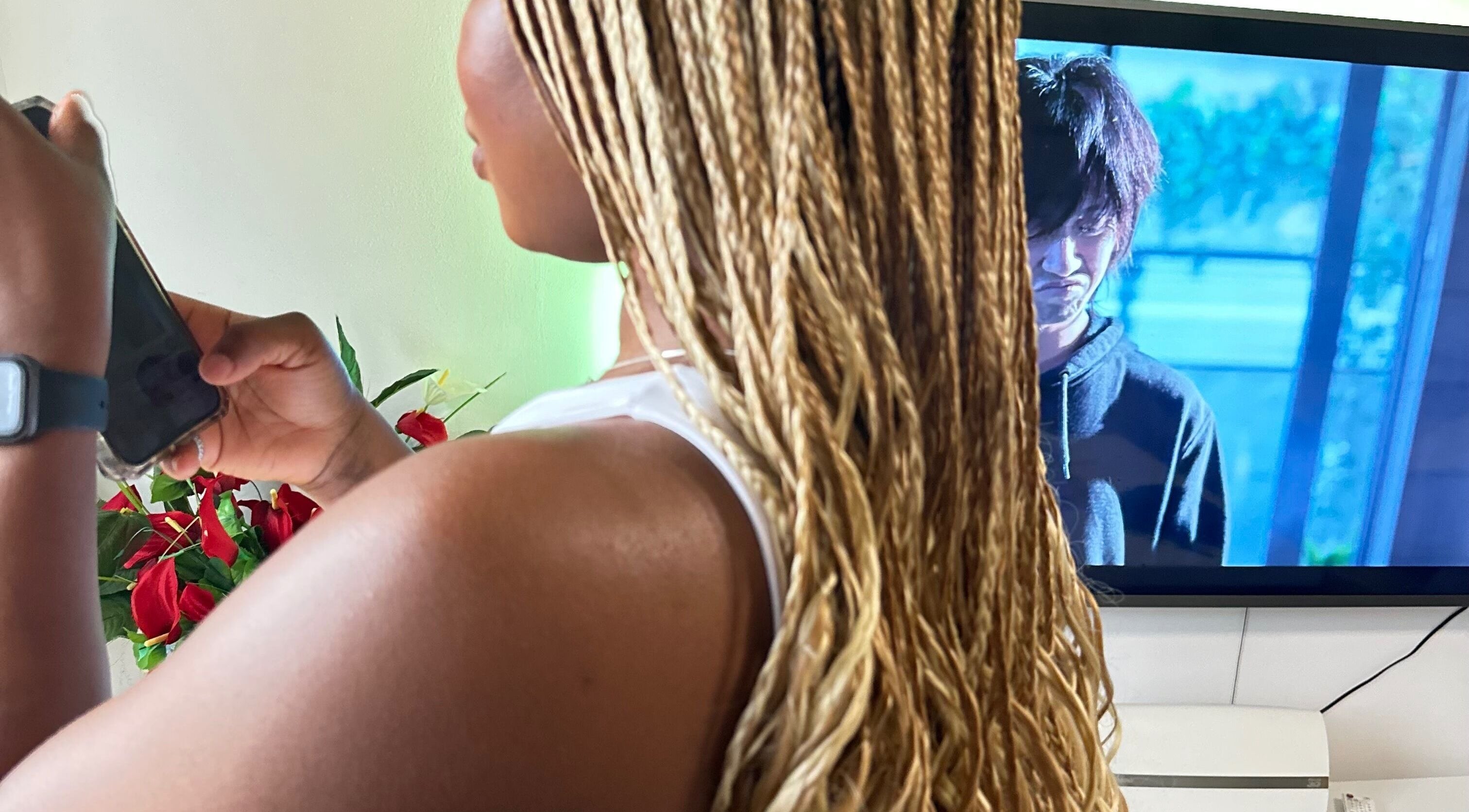 Stylish braids at Hair & Beauty By Sandyrule in Erith, England, GB. Vibrant salon atmosphere.