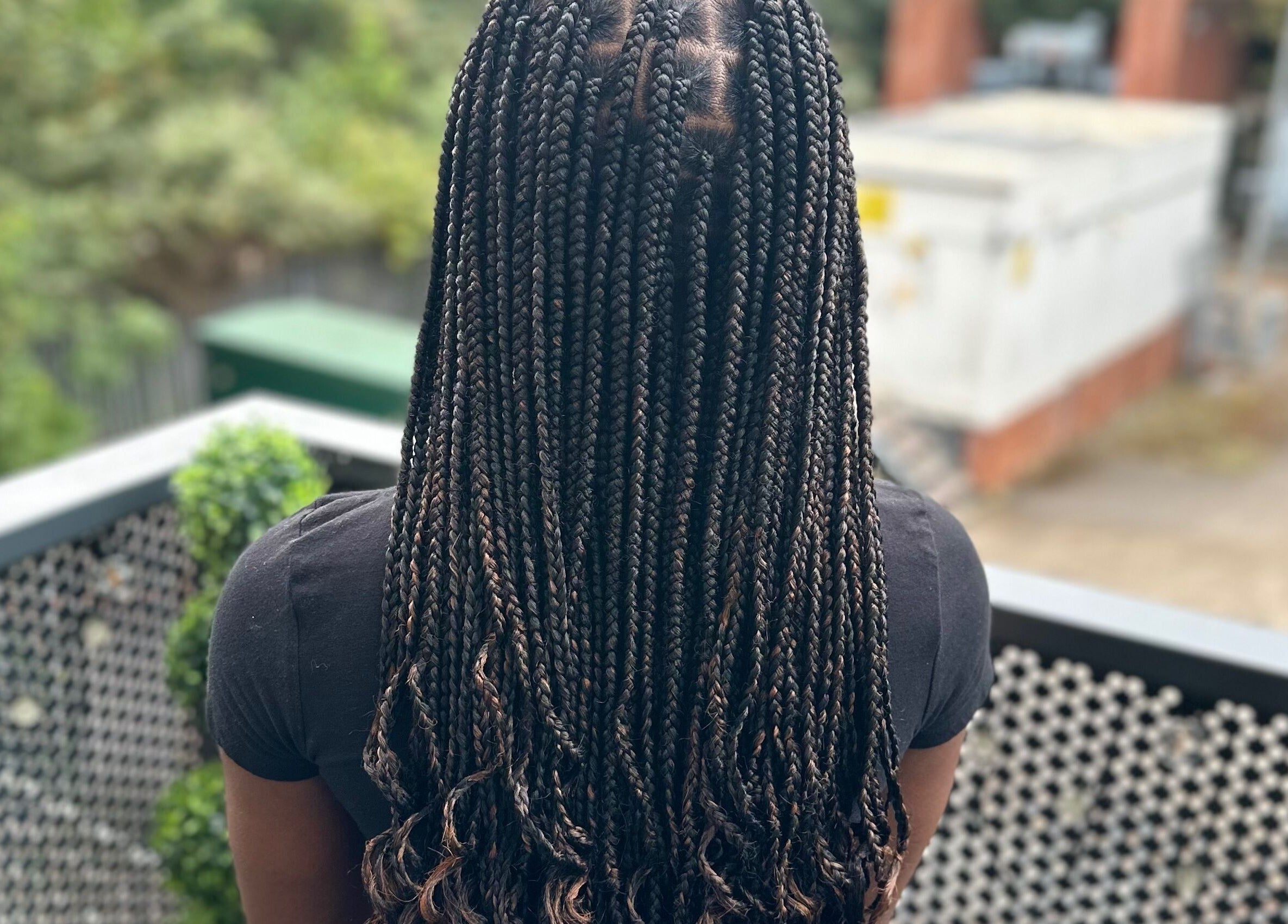 Detailed view of long, intricate braids at Hair & Beauty By Sandyrule in Erith, England, GB.