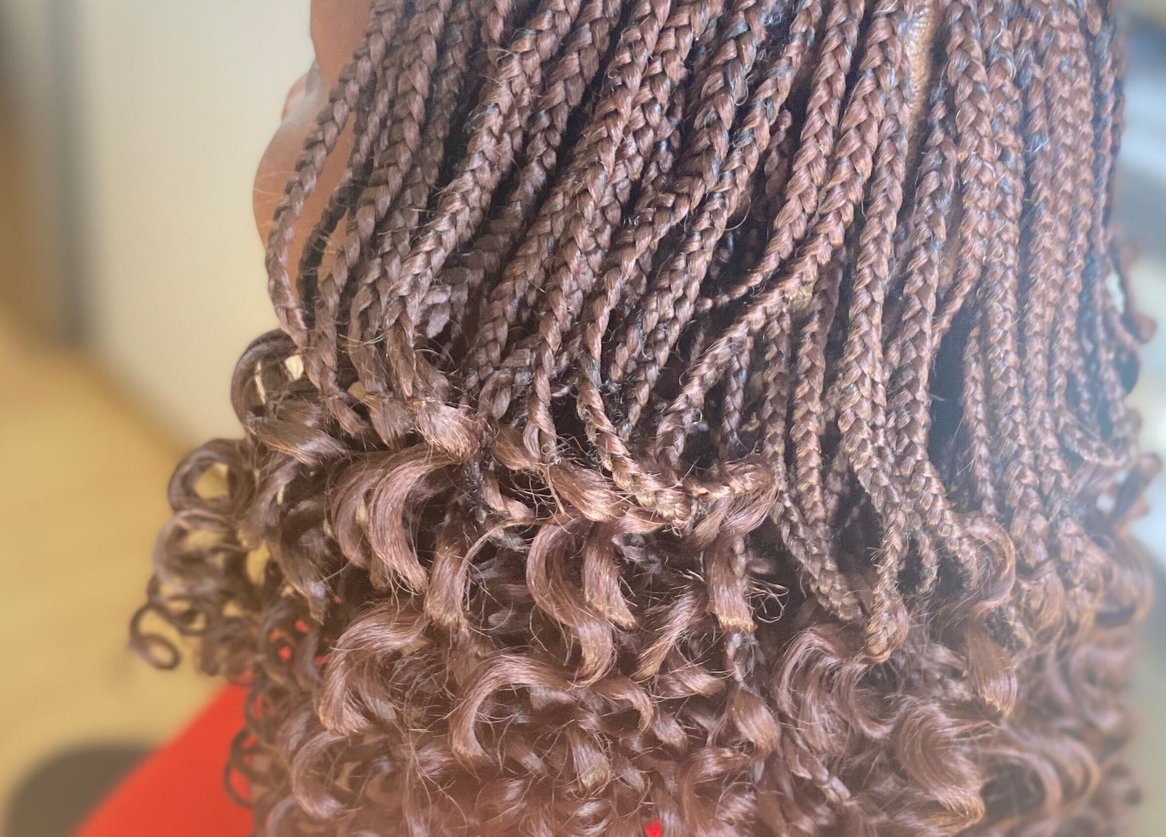 Stylish brown braided hair with curls at Hair & Beauty By Sandyrule, Erith, England, GB.