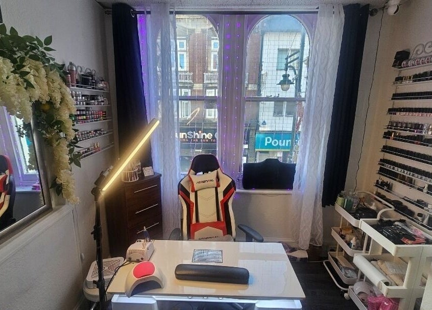 Modern nail studio at Andrea's Nails, Chatham, England, GB, featuring decor and polish display.