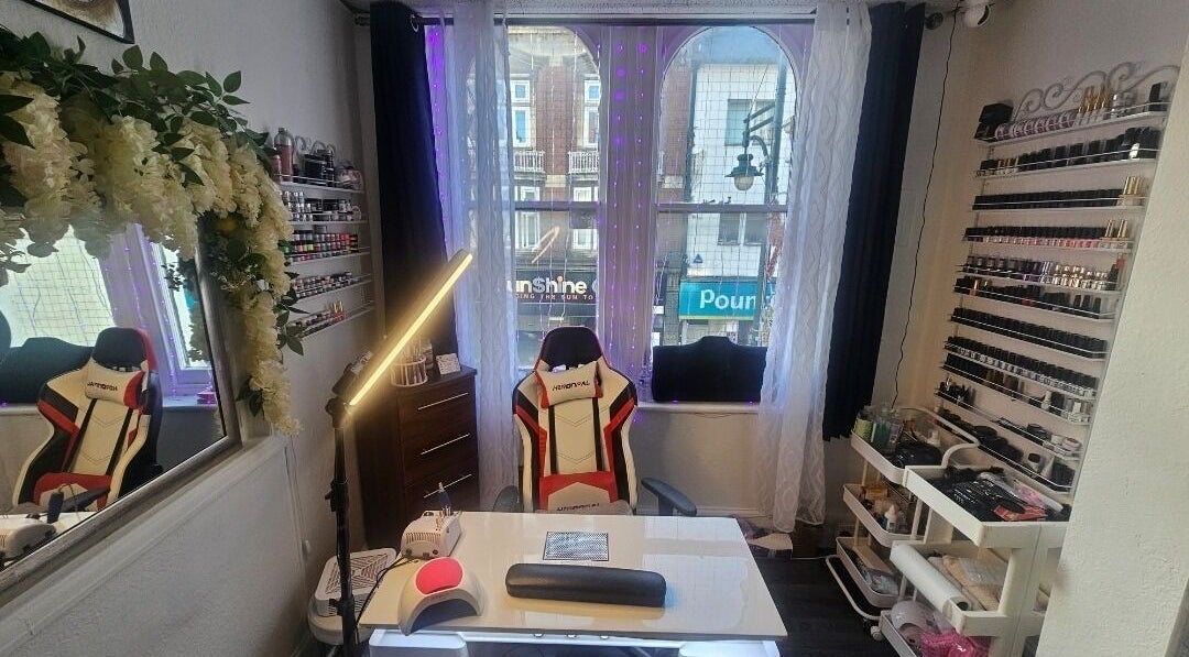 Modern nail studio at Andrea's Nails, Chatham, England, GB, featuring decor and polish display.