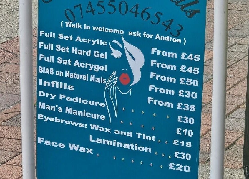 Price list board for nail services at Andrea's Nails, Chatham, England, GB.