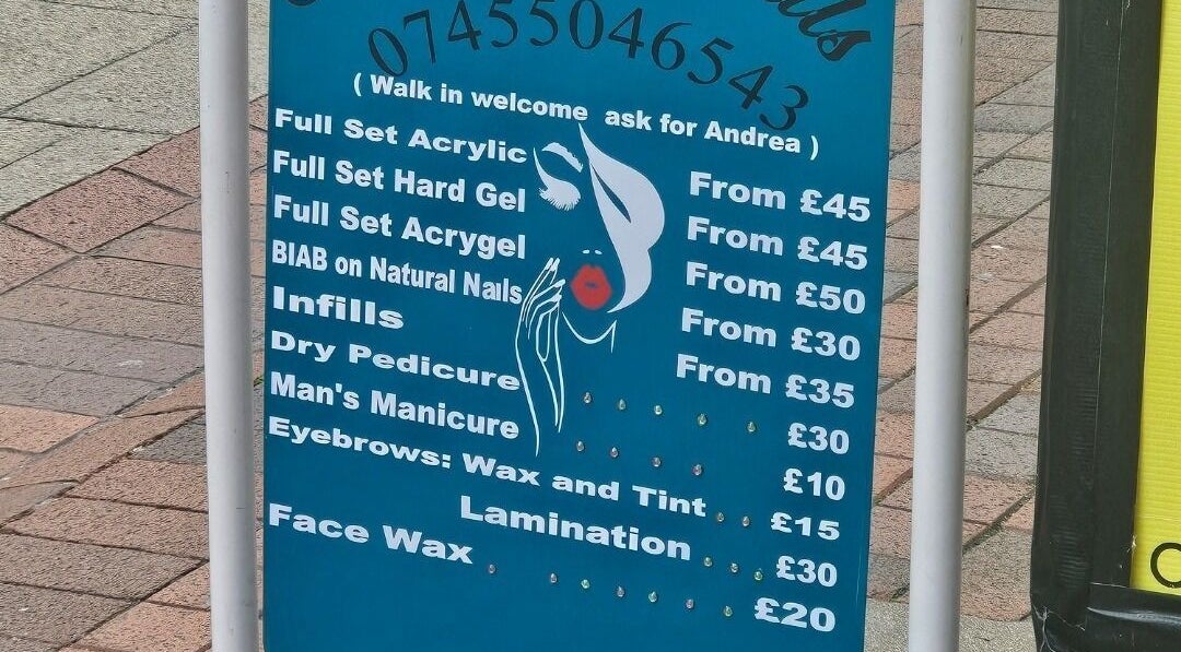Price list board for nail services at Andrea's Nails, Chatham, England, GB.
