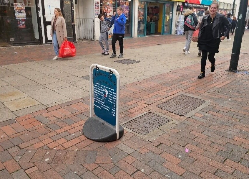 Street view of Andrea's Nails sign in Chatham, England, GB, marking the beauty venue's entrance.