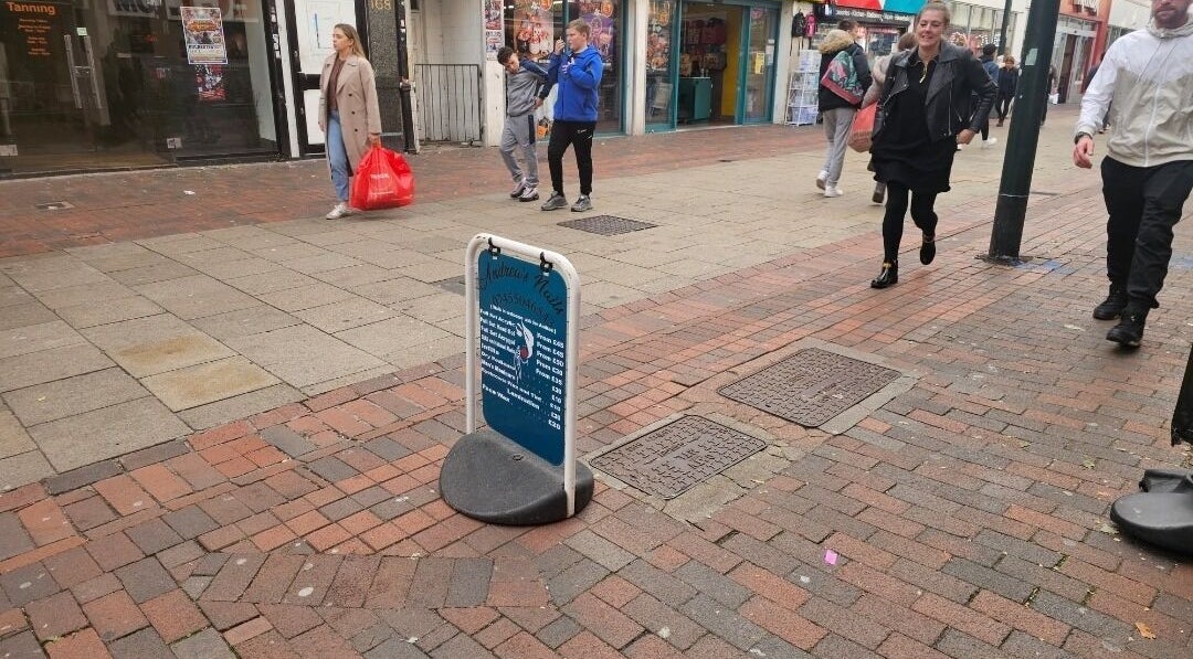 Street view of Andrea's Nails sign in Chatham, England, GB, marking the beauty venue's entrance.