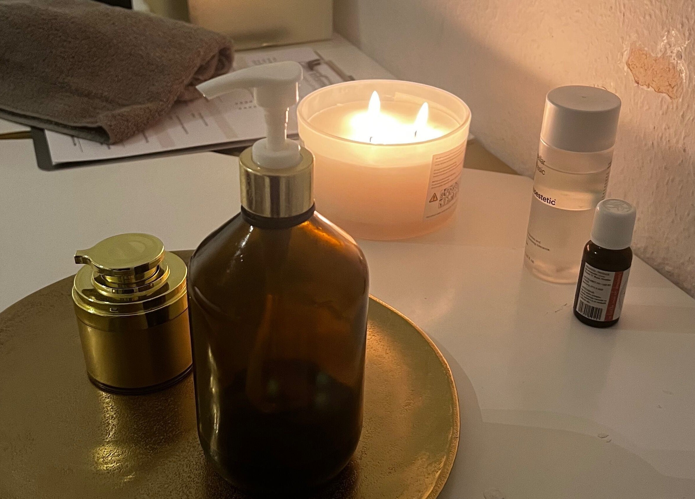 Cozy candle-lit spa ambiance at AERA VIII, Weil Am Rhein, Baden-Württemberg, DE, with elegant beauty products.