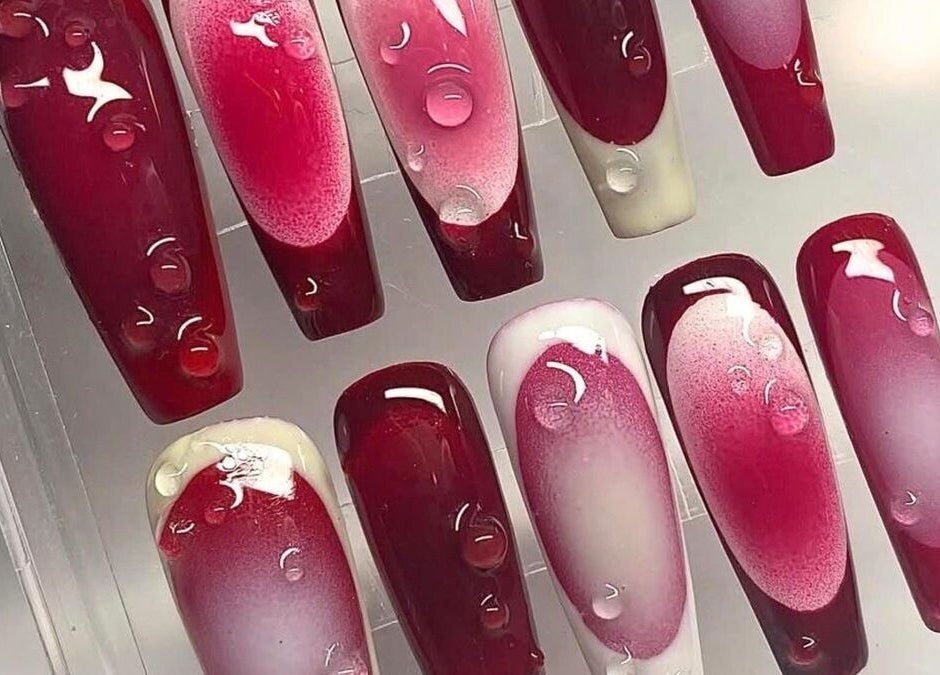 Bold red gel nails on display at Pearl Polishes, Ekiti, Ekiti, NG highlighting expert nail art design.