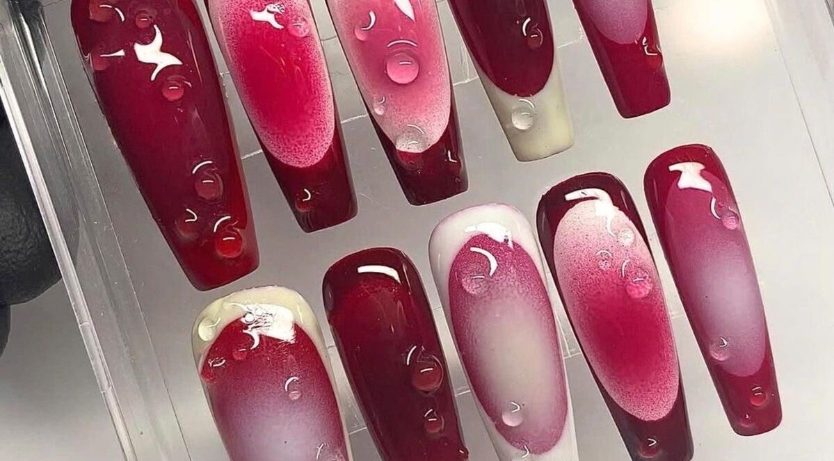 Bold red gel nails on display at Pearl Polishes, Ekiti, Ekiti, NG highlighting expert nail art design.