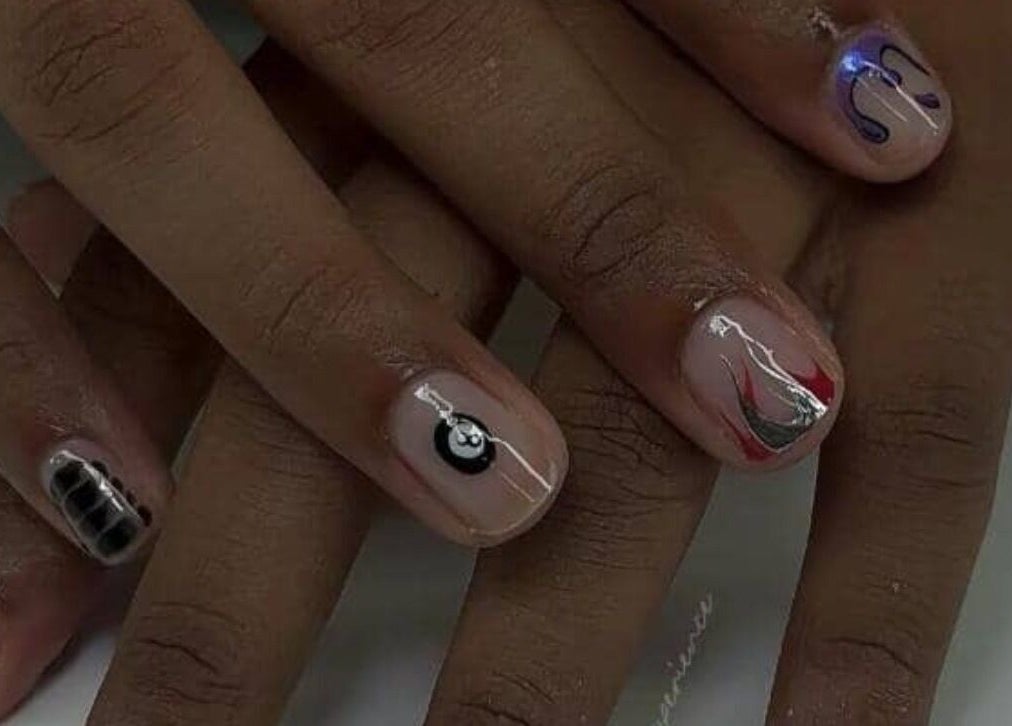 Intricate nail art on display at Pearl Polishes, Ekiti, Ekiti, NG, showcasing elegant design and polish detail.
