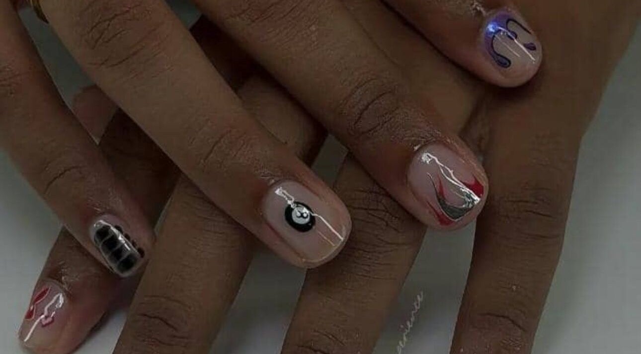 Intricate nail art on display at Pearl Polishes, Ekiti, Ekiti, NG, showcasing elegant design and polish detail.