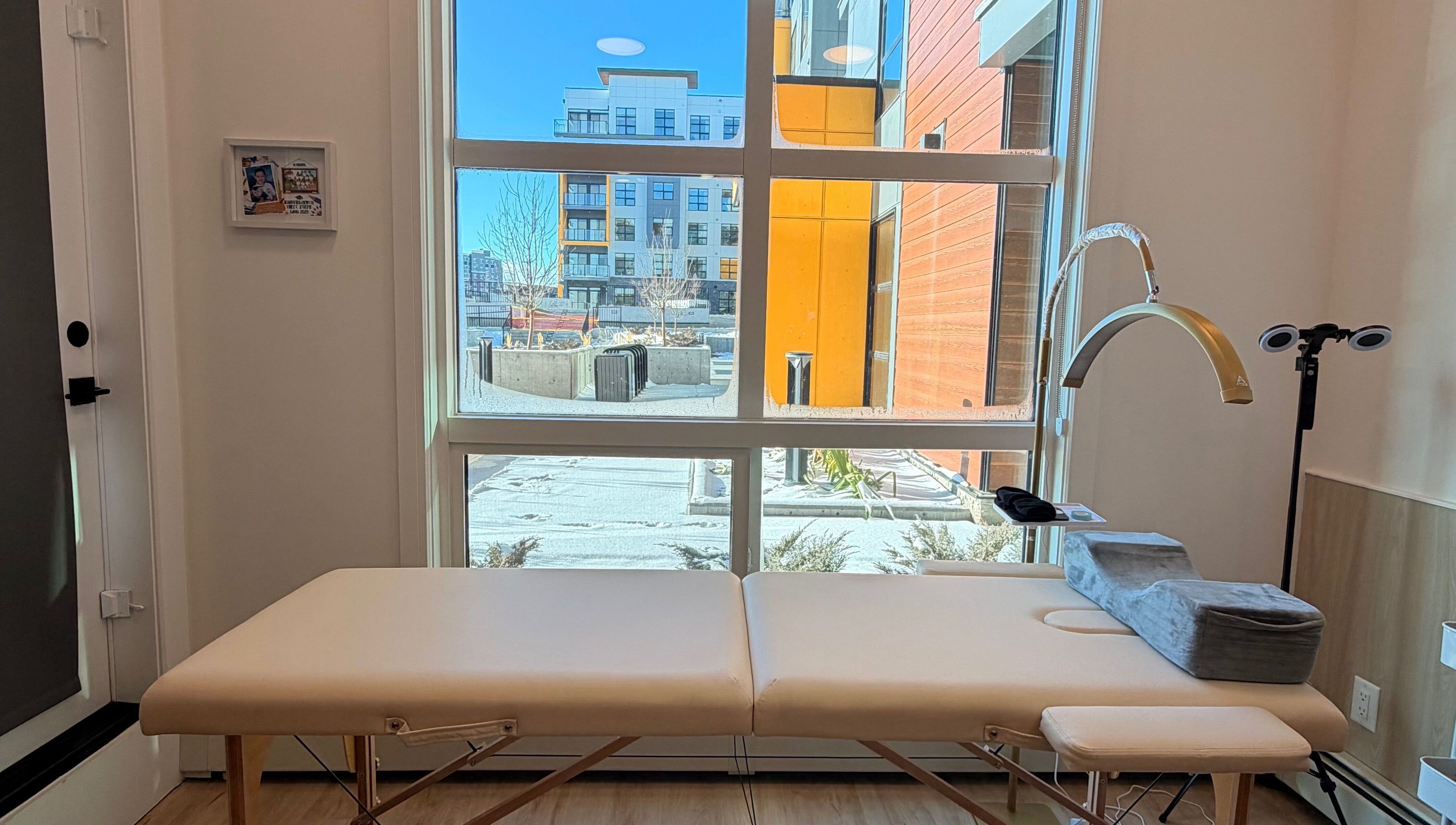 Cozy treatment room at LASH VIBES, Calgary, Alberta, CA with a comfortable massage table.