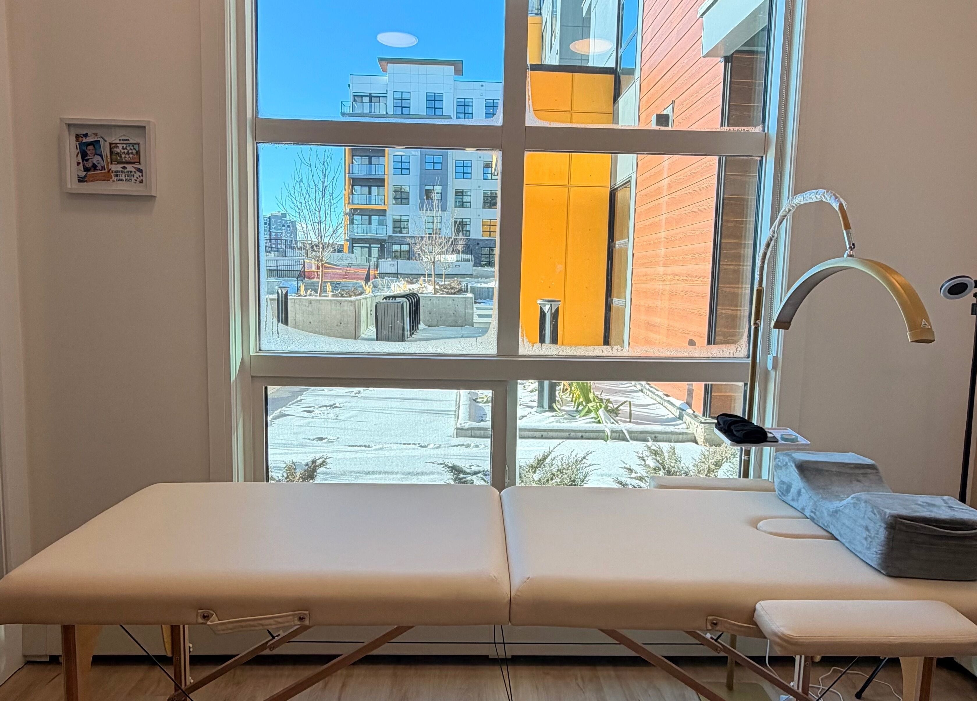 Cozy treatment room at LASH VIBES, Calgary, Alberta, CA with a comfortable massage table.