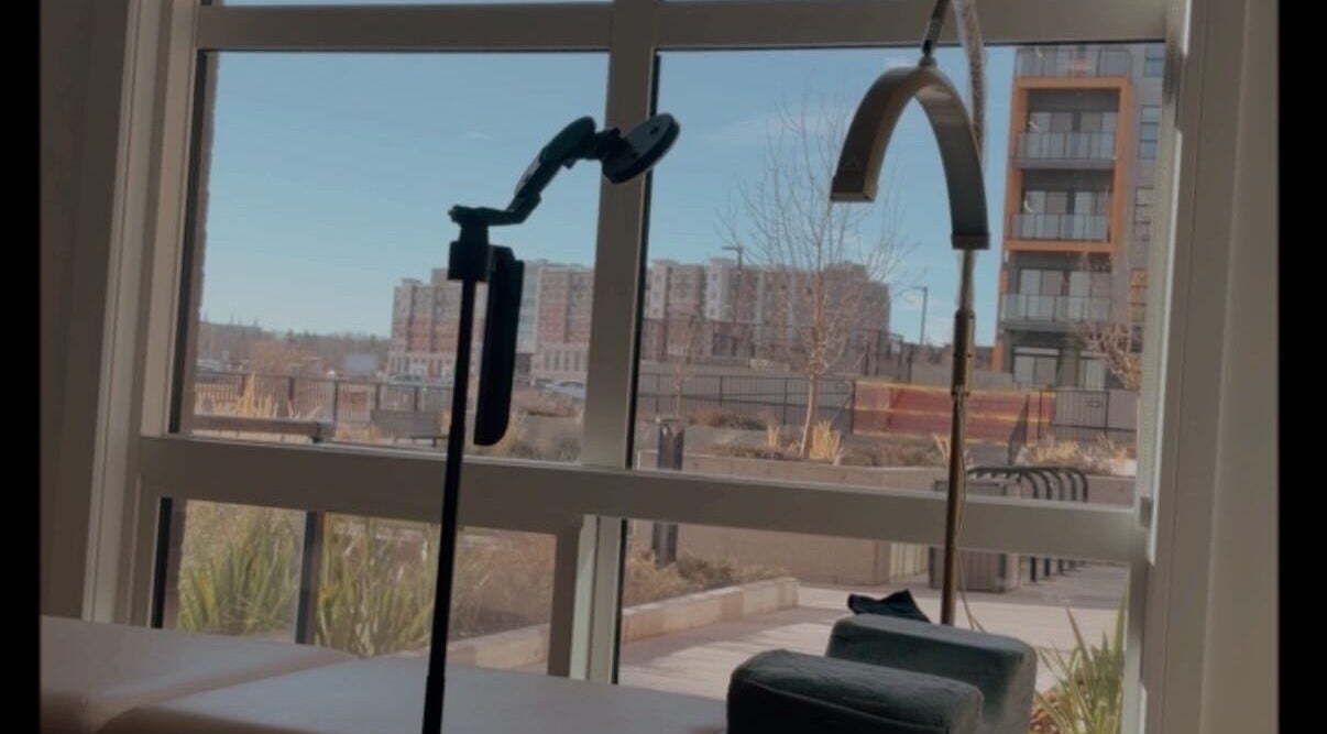 Tranquil treatment area at LASH VIBES in Calgary, Alberta, CA with a bright window view.